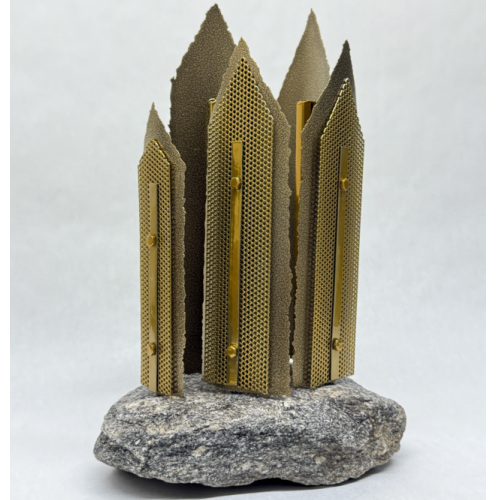 brassy gold spires of metal mounted on stone